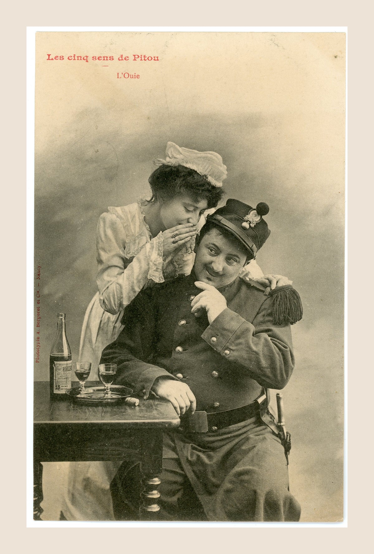 Antique French Bergeret postcard L'Ouïe, showing a young woman whispering into a soldier's ear, Les cinq sens de Pitou, Belle Époque.