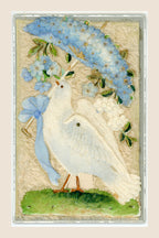 Antique postcard featuring a white dove beneath a parasol covered with blue fabric flowers, with a pale blue bow on a cream textile background.