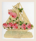 Antique sailboat-shaped greeting card with pink roses in relief, cream sails marked Bonne Année, green leaves and a faded handwritten dedication.