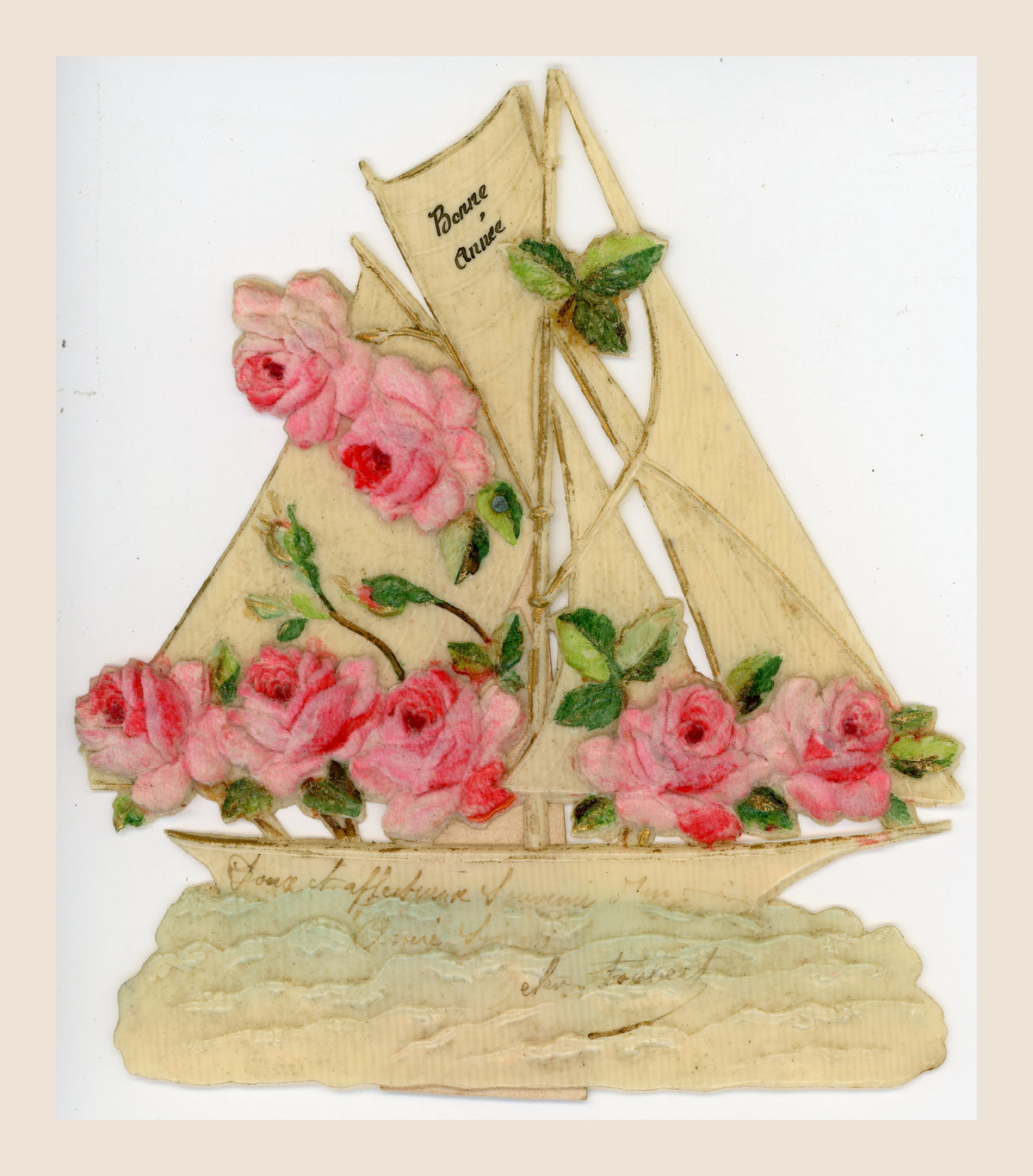 Antique sailboat-shaped greeting card with pink roses in relief, cream sails marked Bonne Année, green leaves and a faded handwritten dedication.