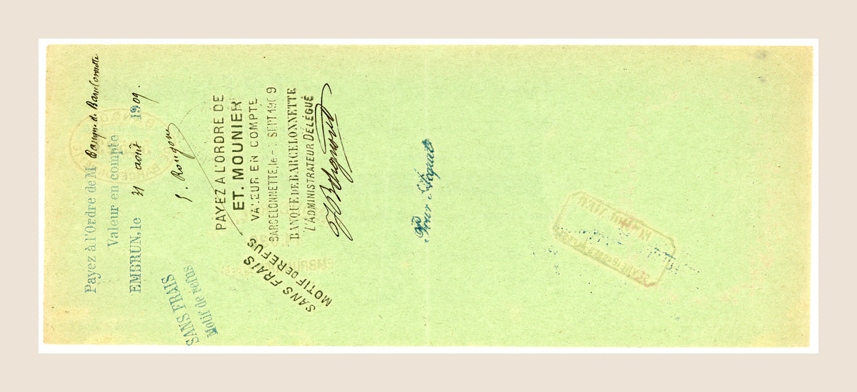 Reverse side of the original 1909 French bill of exchange, showing payment instructions, endorsements and bank markings on pale green paper.