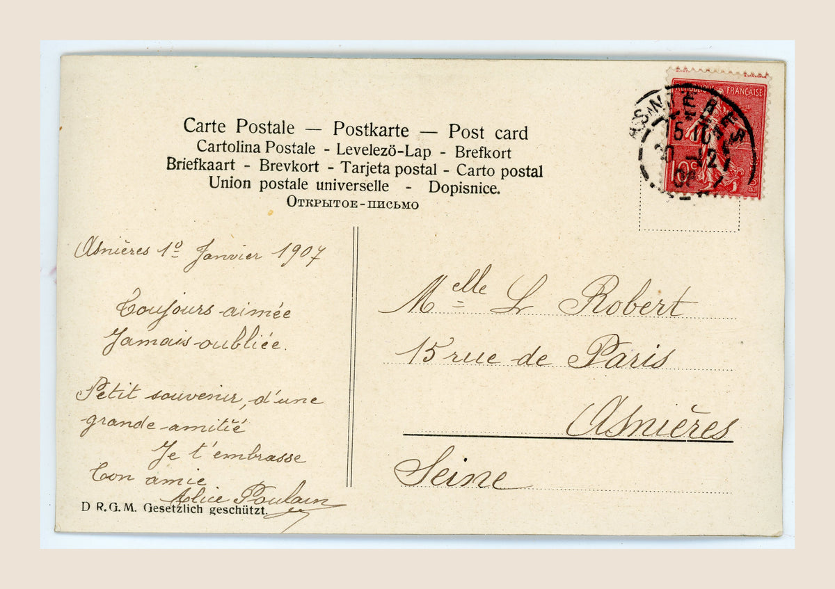 Reverse of the postcard with a French friendship message dated 1 January 1907, an address in Asnières and a cancelled red French postage stamp.