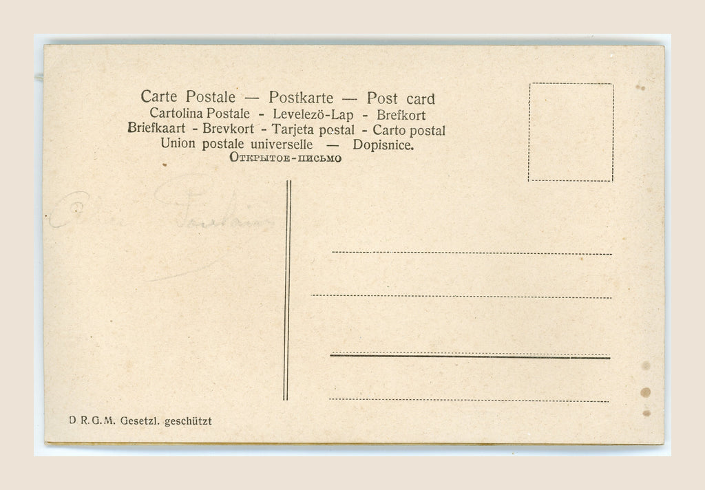 Reverse of an antique postcard with multilingual headings, address lines, faint pencil writing, scattered brown spots and age-toned edges.