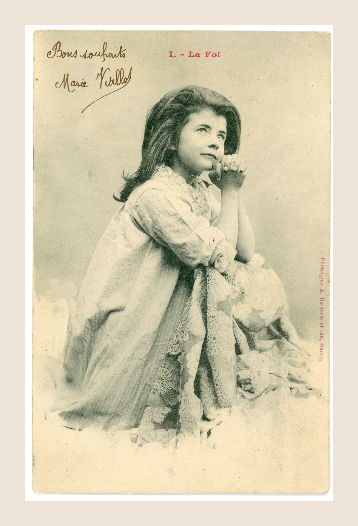 Antique Albert Bergeret postcard No. I La Foi depicting a young girl with clasped hands in a contemplative pose, with original handwritten greeting.