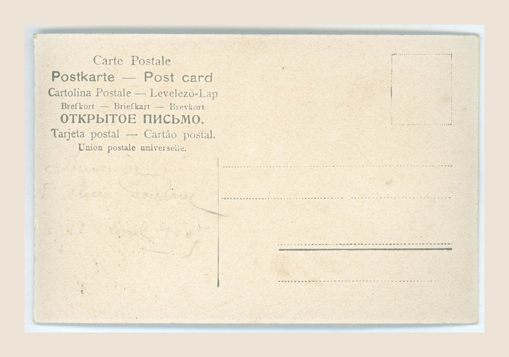 Reverse of an antique postcard with multilingual postal headings, faint pencil writing, address lines, a blank stamp box and age-related spotting.