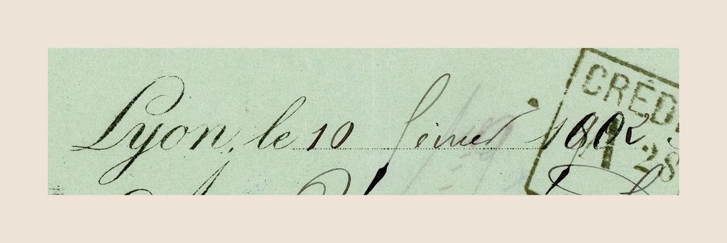 Close-up of handwritten 1902 date on antique French bill of exchange issued in Lyon