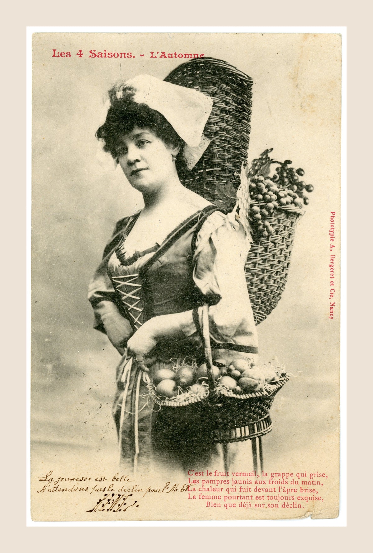Albert Bergeret Les 4 Saisons L'Automne antique French photographic postcard depicting a woman carrying baskets of grapes and fruit, with red poetic verse.