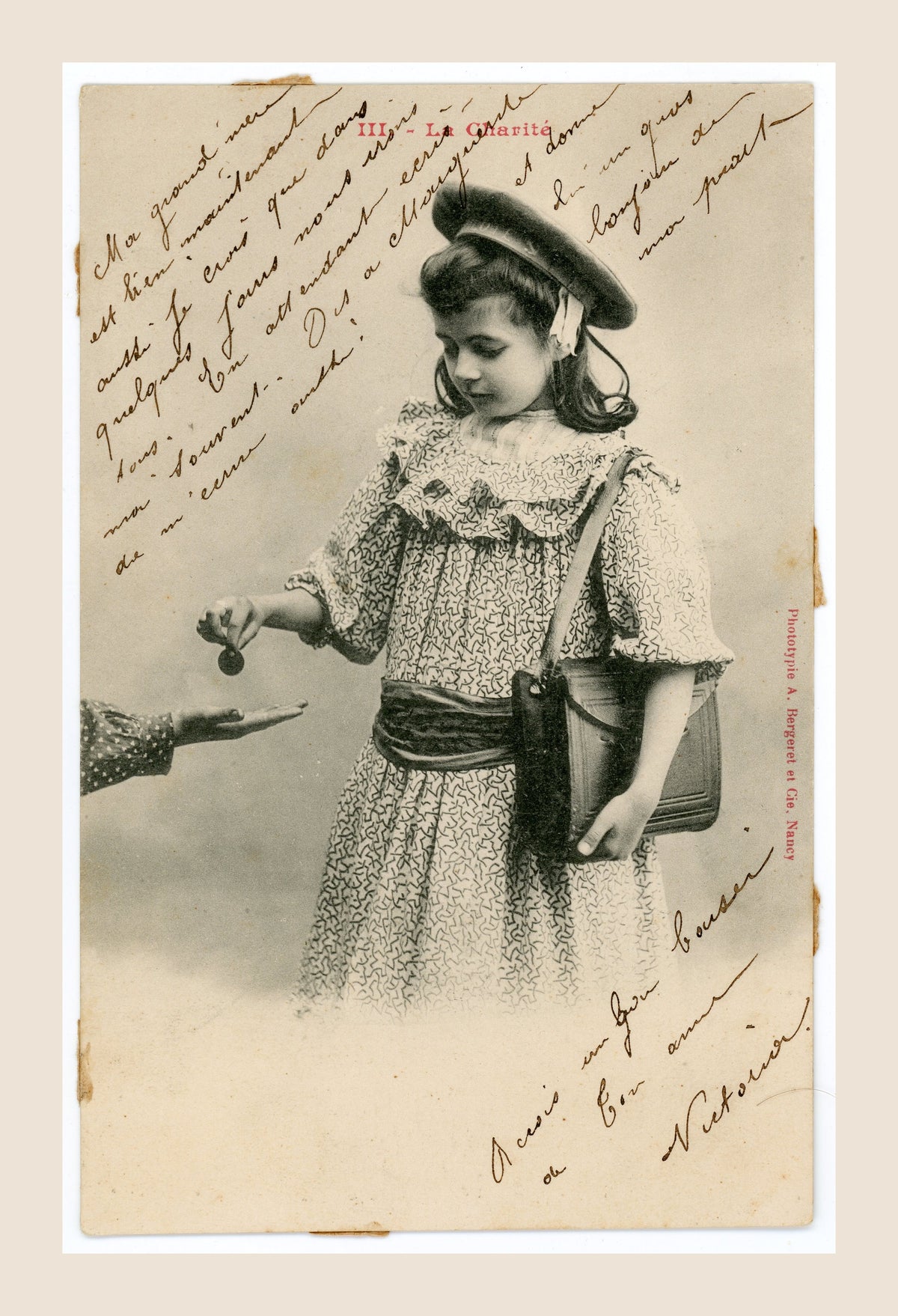 Original Albert Bergeret postcard No. III La Charité showing a young girl offering a coin to an outstretched hand, with antique handwritten correspondence.