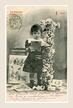 Antique French Bergeret postcard, letter I for Images, featuring a little girl looking at picture cards beside a flower-covered letter I, early 1900s.
