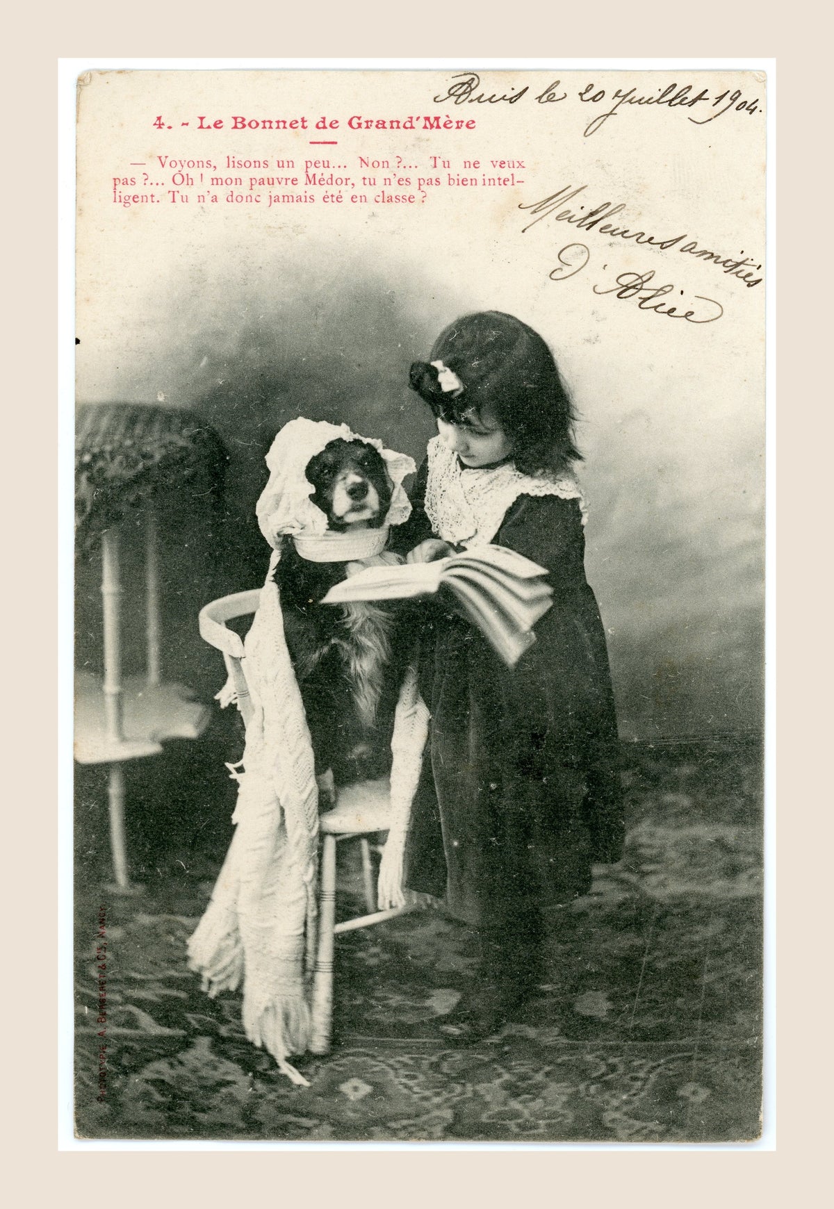 Antique French Bergeret postcard number 4 featuring a little girl reading a book to her dog dressed as a grandmother, with 1904 handwritten greeting.