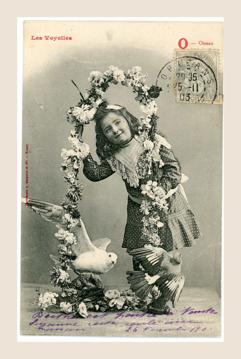 Antique French Les Voyelles letter O postcard by Bergeret, featuring a young girl with birds and a circular floral garland, Belle Époque.