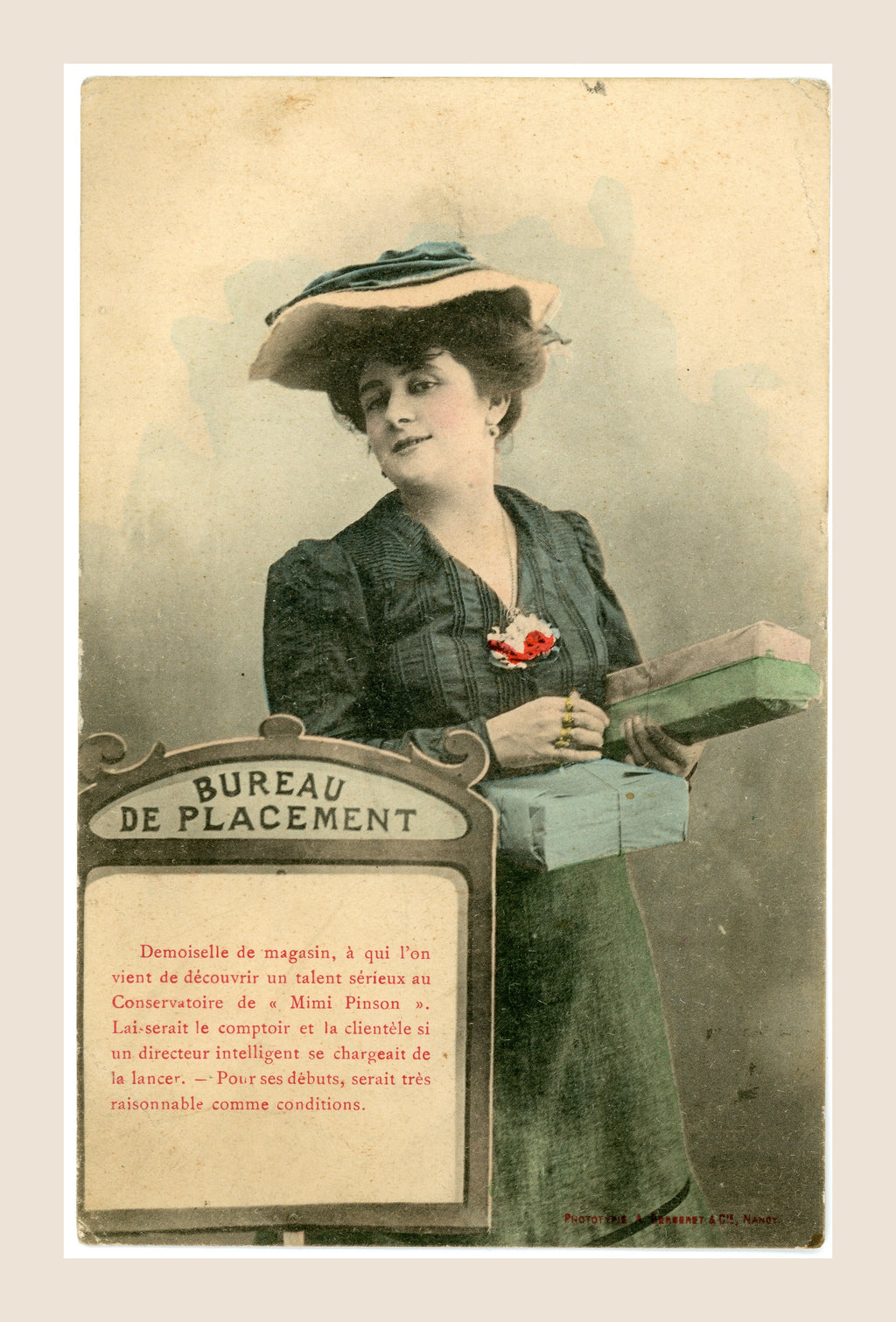 Antique French Bergeret Bureau de Placement postcard depicting an elegant Belle Époque shop assistant holding boxes, with humorous employment text.