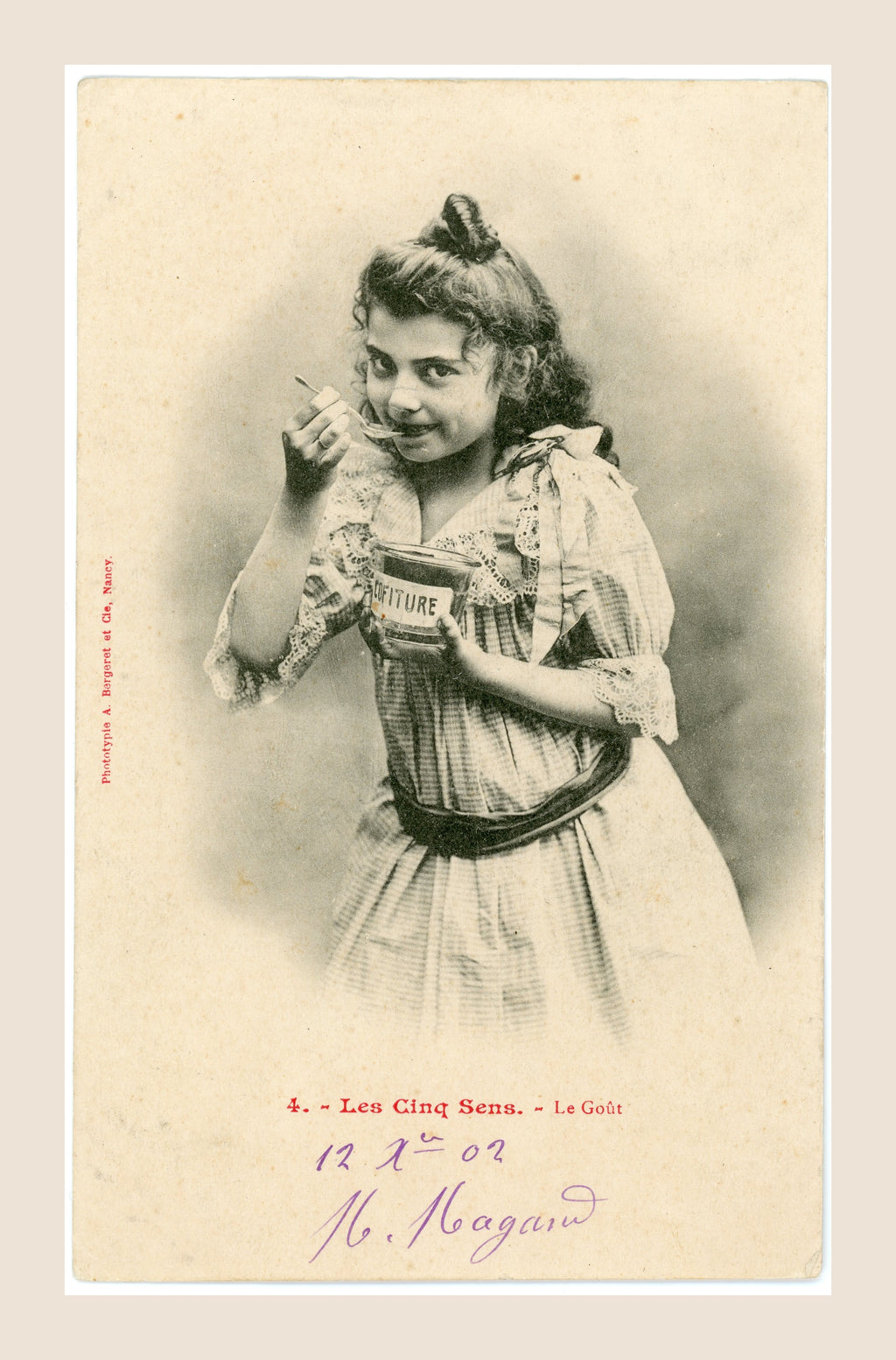 Antique Bergeret Les Cinq Sens Le Goût postcard depicting a Belle Époque girl eating jam from a Confiture jar with a spoon, circa 1903.