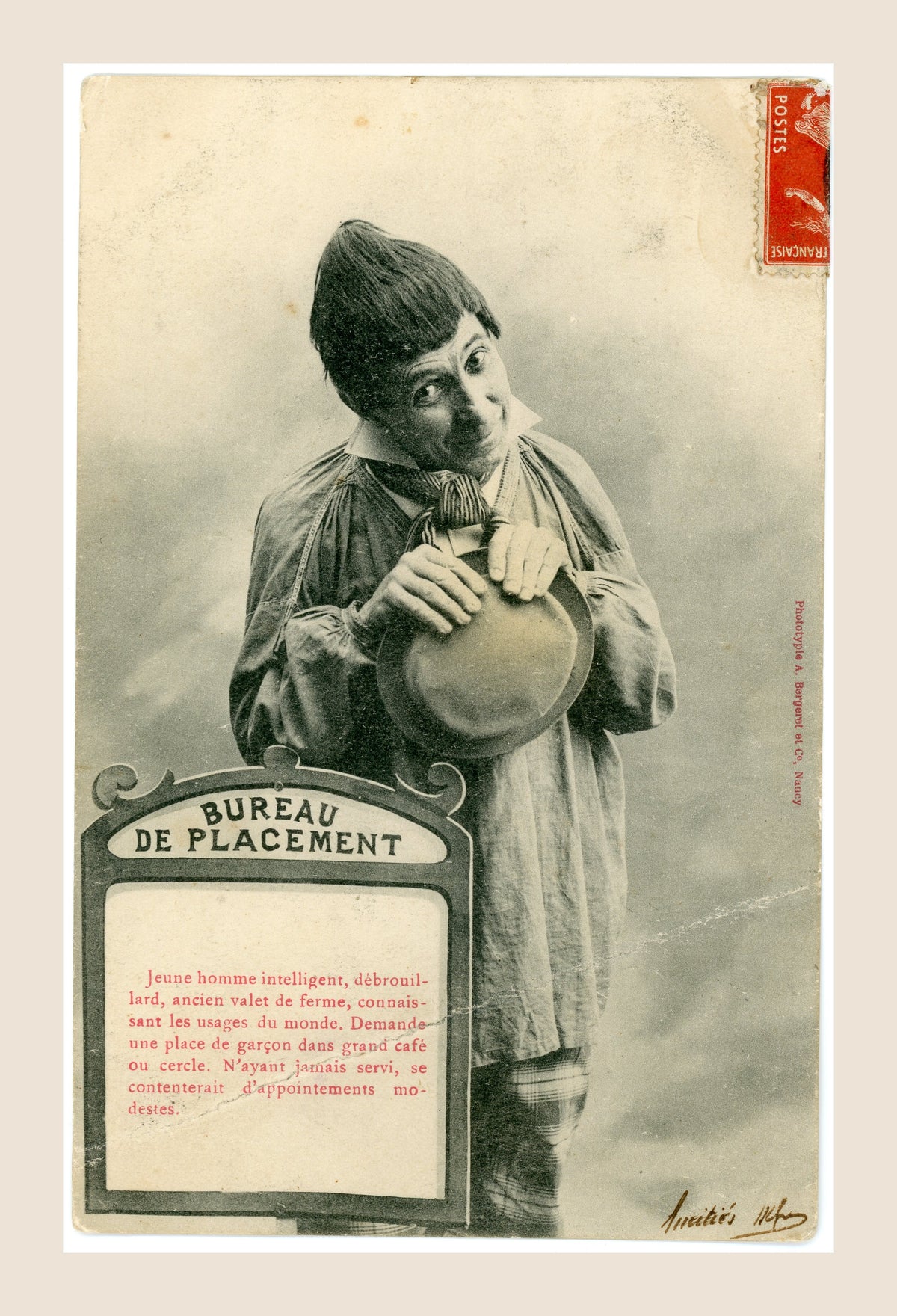Original Albert Bergeret Bureau de Placement humorous postcard depicting a young former farm servant holding a hat, French Belle Époque photography circa 1903.