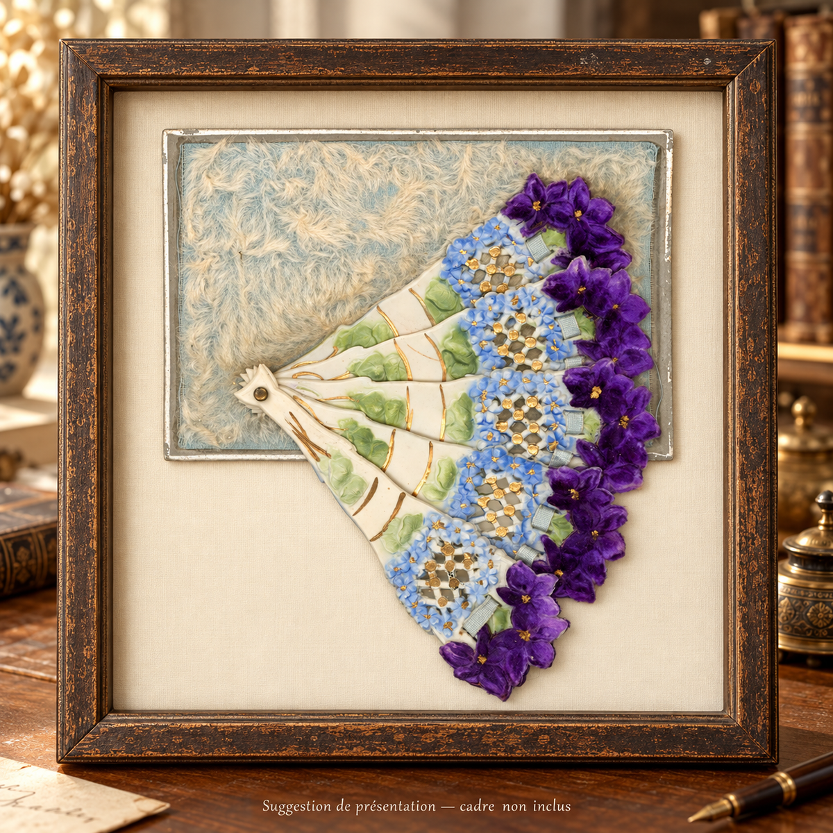 Antique floral fan postcard displayed open in a dark wooden shadowbox frame on a vintage desk. Suggested presentation; frame not included.